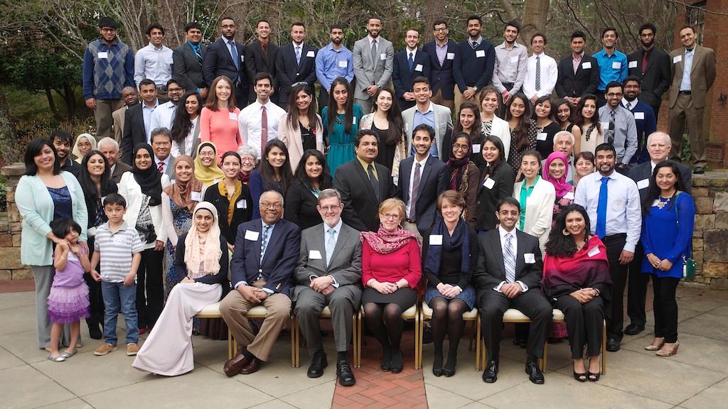 large group of emory muslim alumni posing for a service award picture
