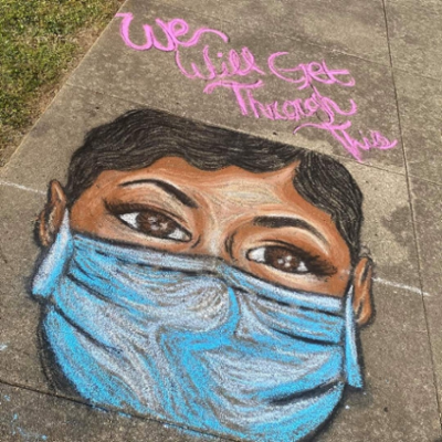 Sidewalk Chalk Art of a woman with a mask on